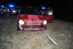 2005 Dodge Neon knocks over stop sign. Occupants flee but were later arrested