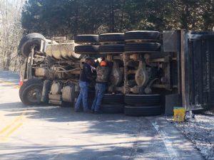 Dump Truck Loaded with Gravel Overturns