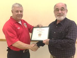 Smithville Fire Chief Charlie Parker presented an award to former Smithville Volunteer Firefighter and local business man Walter Burton, who served for 25 years on the department starting in 1972.