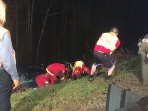 After removing Courtney Nichols from the Jeep, fire and rescue volunteers used climbing rope and a stokes basket to bring her to the top of the hill.