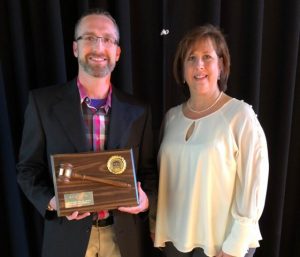 Retiring Chamber President Isaac Gray recognized at Banquet. Pictured with New Chamber President Rita Bell