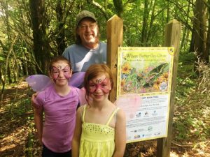 Bruce Tunnicliffe and Skylar and Grace Chausse among the first to walk the Story Book Trail after the ribbon cutting in 2018