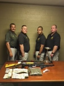 Sheriff’s Department officers confiscated 15 grams of methamphetamine, 6 ounces of marijuana, an assortment of prescription pills, one rifle, two shotguns, three pistols, digital scales, glass pipes, and possible stolen power tools. Detectives also seized $427.00 in cash