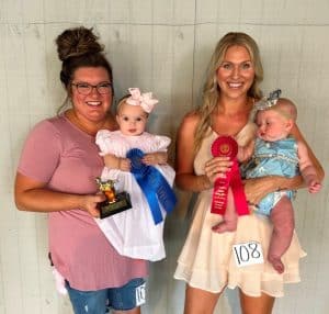 DeKalb Fair Baby Show: Girls four-months to six months: From left, winner Parker Kayte Harvey, the six-month-old daughter of Chad and Kayla Harvey of Alexandria; runner-up Indy Hart Williams, the four-month-old daughter of Brian and Stephanie Williams of Smithville.