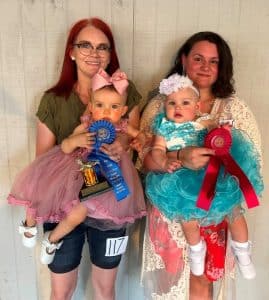 DeKalb Fair Baby Show: Girls 10-12 months: From left, Winner Astrid Skylar Adams, the 12-month-old daughter of John and Amber Adams of Smithville; runner-up Madison Faith Bandy, the 11-month-old daughter of Tara Bandy of Smithville.