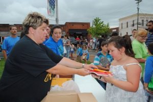 Students getting free school supplies from Dowelltown Baptist Church booth last year at First Day of School Education Celebration