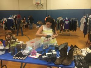 Student shopping the DMS Saint Bernard Clothing Market