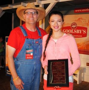 Fiddlers Jamboree Coordinator Sam Stout with 2017 Grand Champion Fiddler Ivy Phillips