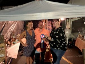 David Plassman and Amanda of Brush Creek received the Jamboree's "Best Newcomer" craft award Saturday for his twisted copper wire art work. The award was presented by Dana Scott, Director of Crafts (right)