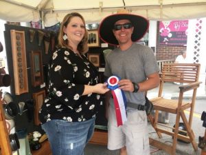 Jonathan Griffith of Murfreesboro received the Jamboree's "Best Appalachian Craft” award for his display of functional clay pieces and glazed paintings in wooden frames. Presented by Dana Scott, Director of Crafts