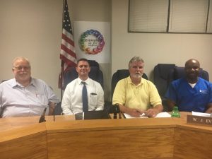 School Board Vice Chairman Danny Parkerson, Director Patrick Cripps, Chairman W.J. (Dub) Evins III, and Assistant Secretary Shaun Tubbs