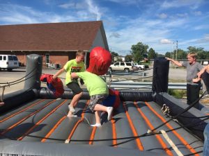 Kids enjoying boxing ring inflatable during After School event at the Smithville Church of God