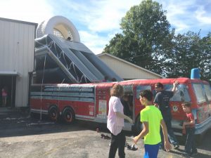 Kids enjoying Fire Engine Inflatable during After School event at the Smithville Church of God