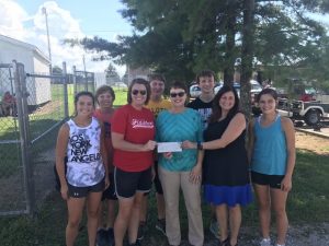 DeKalb County High School Cross Country was recently presented a donation from First Bank . Pictured:: Ellie Cripps, Ian Paledino, Coach Melissa Ruch, Ethan Jenkins. Kathy Goodwin (First Bank), Luke Jenkins, Coach Sonya House, and Mya Ruch