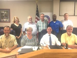 Today's Board of Education: SEATED-Doug Stephens, Jamie Vickers (secretary), Director Patrick Cripps, W.J. (Dub) Evins III. STANDING- Kate Miller, Danny Parkerson, Alan Hayes, Shaun Tubbs, and Jim Beshearse