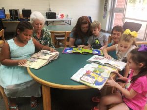 Kaydence Johnson, Retired Teacher Carolyn Adcock, Chrystal Reed, Tristan Reed, Northside Elementary Librarian Libby McCormick, Taylor White, and Hayden Reed