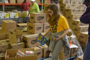 Jr. Beta Chloe Dies helps with food distribution at Joseph's Storehouse in Lebanon.