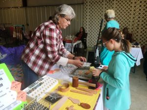 Katie Dheere of OMG Leatherworks (left) with Charlotte Cripps at Paislee’s Foundation Craft and Home Show Saturday