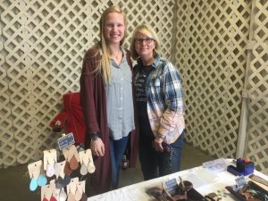 Chelsea Breece (left) of Chelsea’s Leather Makes with Melissa Ferrell at the Paislee’s Foundation Craft and Home Show Saturday