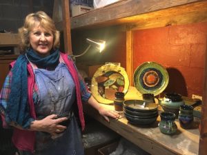 Susan DeMay displays her production pottery line including functional table top wares