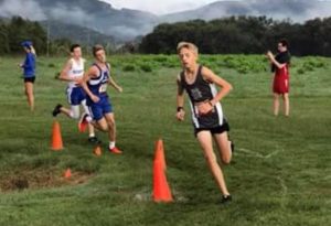 Aaron Gottlied captured the title of the boys varsity race conquering the two mile course with a time of 11:32