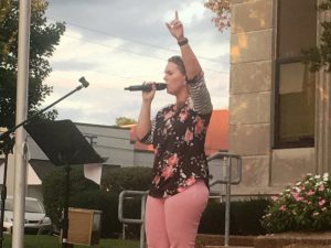 Emily Phillips singing from the steps of the courthouse during Prayer on the Square last year