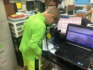 Students looks through Celestron Telescope