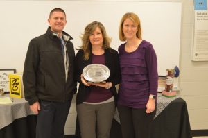 Director of Schools Patrick Cripps (left) and DWS Principal Sabrina Farler (right) pose with longtime teacher Janet England.