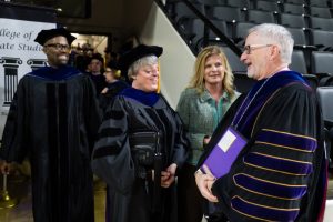 Sarah Cripps with her sister Rachel and Tennessee Tech President Phil Oldham