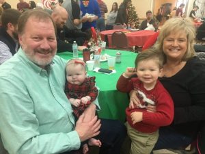 Brett and Sherree Curtis and their grandchildren Elsie (left) and Severin (right) enjoying Breakfast with Santa