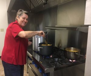 Helga Thompson working in the kitchen