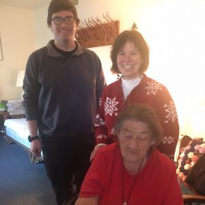 Jen and son Nate Sherwood deliver Christmas Eve meal on behalf of DESA to Gladys Haggard on Andrew Street