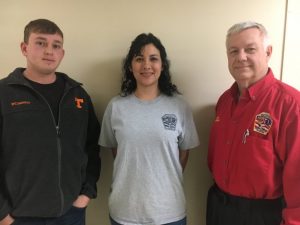 Smithville Fire Chief Charlie Parker welcomes two new rookie members Dillon Hicks and Brenda Soto