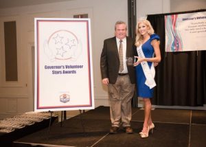 Miss Tennessee 2018, Christine Williamson, presents Blake Cantrell a Governor's Volunteer Star Award