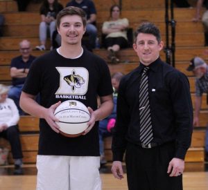 DCHS Tiger Basketball Senior Tanner Poss Honored as Member of 1,000 Point Club. Pictured with Tiger Coach John Sanders