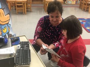 Martha Cantrell with her 8 year old granddaughter Chloe Miller during Family Read Night Thursday at Smithville Elementary School