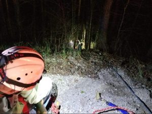 Climbing rope and a stokes basket were used to gain access to the victim and bring him to the top of the hill.