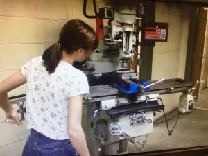 DCHS CTE Machining Technology Course (Student working to make metal objects on milling machine.