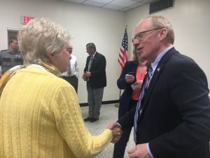 Congressman John Rose speaks with Walteen Parker, Chairman of the DeKalb Election Commission. County Mayor Tim Stribling and Sheriff Patrick Ray in the background