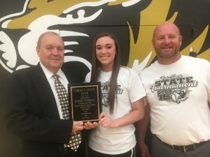 Roy Nelson Pugh of Liberty State Bank presented a plaque to Kadee Ferrell for scoring 494 points and grabbing 247 rebounds breaking a single season scoring record previously held by Maggie Knowles. Pictured with Lady Tiger Coach Danny Fish