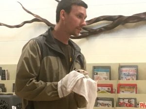 Andrew Webber, Seasonal Interpretive Park Ranger at Edgar Evins State Park shows off “Otis” a three month old Opossum during Thursday’s Summer Reading Club Program at Justin Potter Library