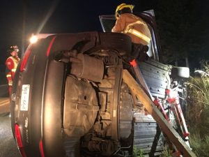 Members of the DeKalb County Fire Department Extrication and Rescue Team stabilized 2014 Kia Forte before trying to access 24 year old Kimberly Gunter trapped inside the car after rollover wreck Wednesday morning on Highway 146.