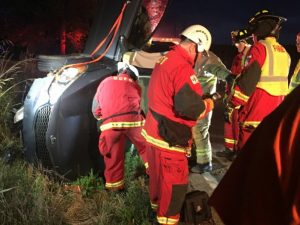 Members of the DeKalb County Fire Department Extrication and Rescue Team were summoned to help get Kimberly Gunter out of her car after a rollover crash on Highway 146 early Wednesday morning