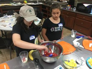 Kiana Driver and Carol Shinkle making yogurt parfaits