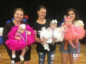 Miss Jamboree Pageant (Ages 1 day to 6 months), the winner is Jahlia Nicole Cantrell (center). Runners-up pictured left to right: 1st-Blakelyn Kate Hendrix, Queen Jahlia Nicole Cantrell, and 2nd-Laurel Cait Kilgore