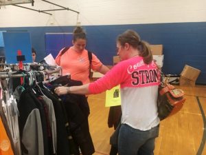 After registration for the new school year Tuesday evening, sixth graders at DeKalb Middle School and their parents got to shop for clothes as the Saint Bernard Clothing Market opened for business in the gym.