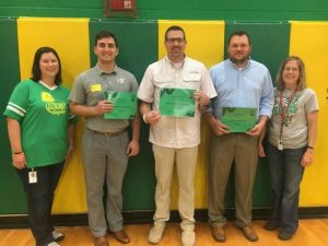 Northside Elementary Principal Karen Knowles (left) and Assistant Principal Beth Pafford (right) present certificates of appreciation to Jacob Parsley of Liberty State Bank (next to Knowles) and J.D. Bratten of Liberty Machine Shop (next to Pafford) for sponsoring summer field trips for students and to Pastor Chad Ramsey of the Smithville First Baptist Church (center) for the church’s adopting Northside Elementary School for special attention and activities this year.