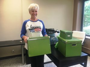 Chamber Director Suzanne Williams spends Tuesday packing and moving from her Courthouse Chamber Office to a new location in the County Complex