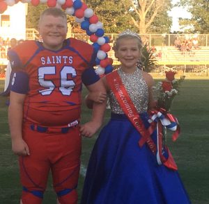 DeKalb West School Saints Homecoming 7th grade attendant Caroline Crook with escort Aaron Hatfield