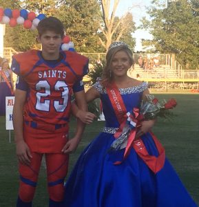 Saints Homecoming 7th grade attendant Annabella Dakas with escort Gabe Hollingsworth